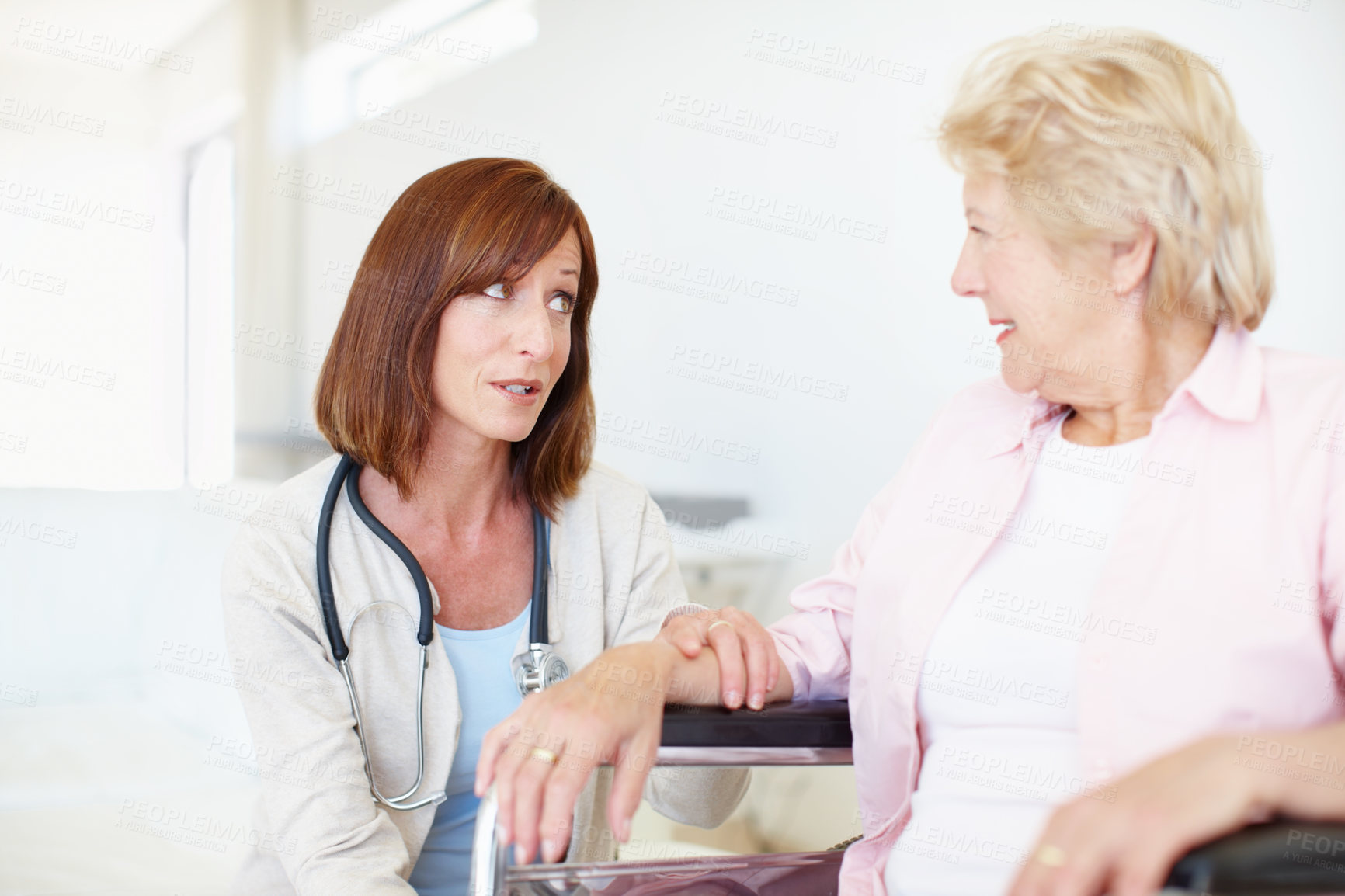 Buy stock photo Woman, doctor and senior patient with wheelchair for elderly care, consultation or medical aid at hospital. Healthcare, worker or employee talking to person with a disability for advice or therapy