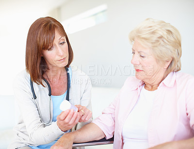 Buy stock photo Women, doctor or senior patient with medication for elderly care, consultation or side effects at clinic. Healthcare, worker or employee talking to person with a disability for dosage or prescription