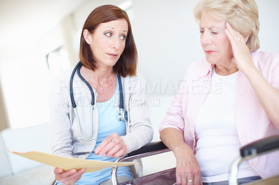 Buy stock photo Elderly patient receives some disturbing news from her nurse