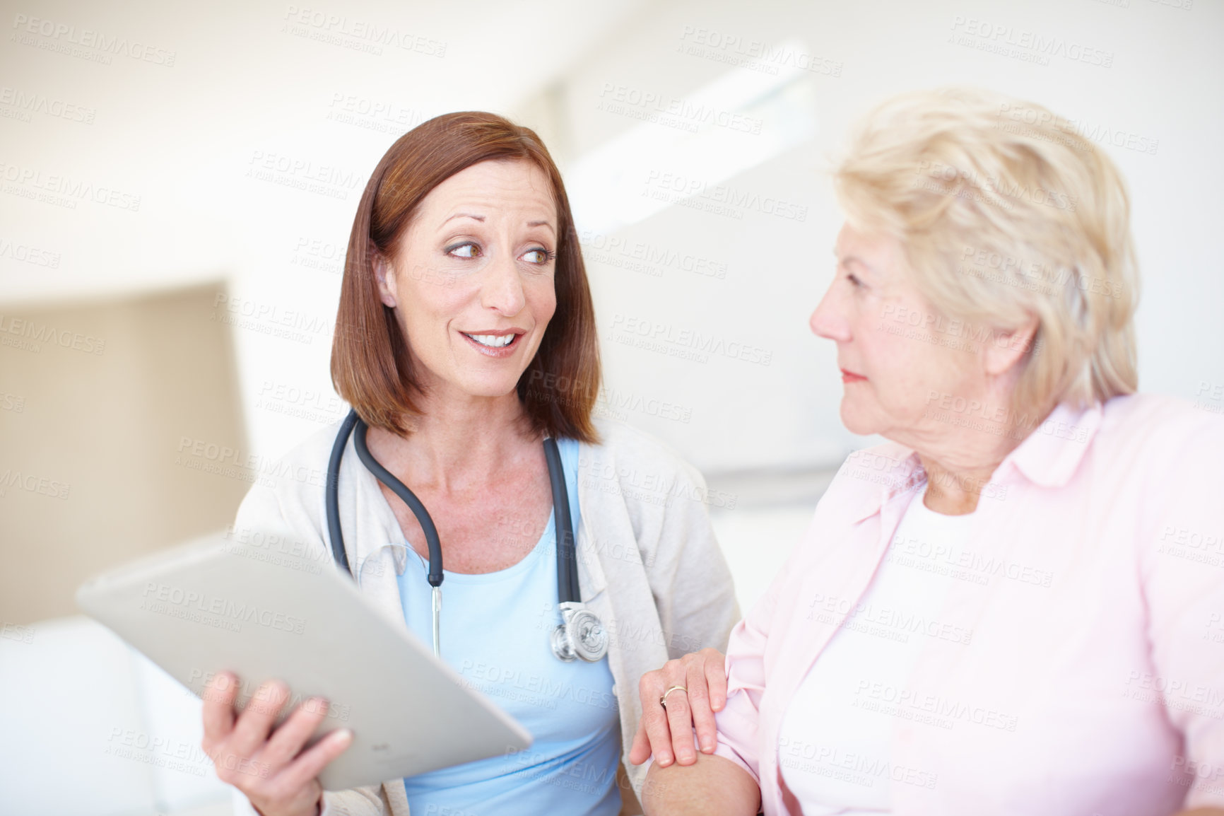 Buy stock photo Women, patient and doctor with tablet for elderly care, consultation or medical results at clinic. Healthcare, worker or employee talking to senior person with technology for health advice or news