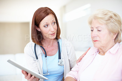 Buy stock photo Woman, senior patient and doctor with tablet for consultation or bad news at clinic. Female people, healthcare worker or employee talking to senior person with technology for elderly care or results