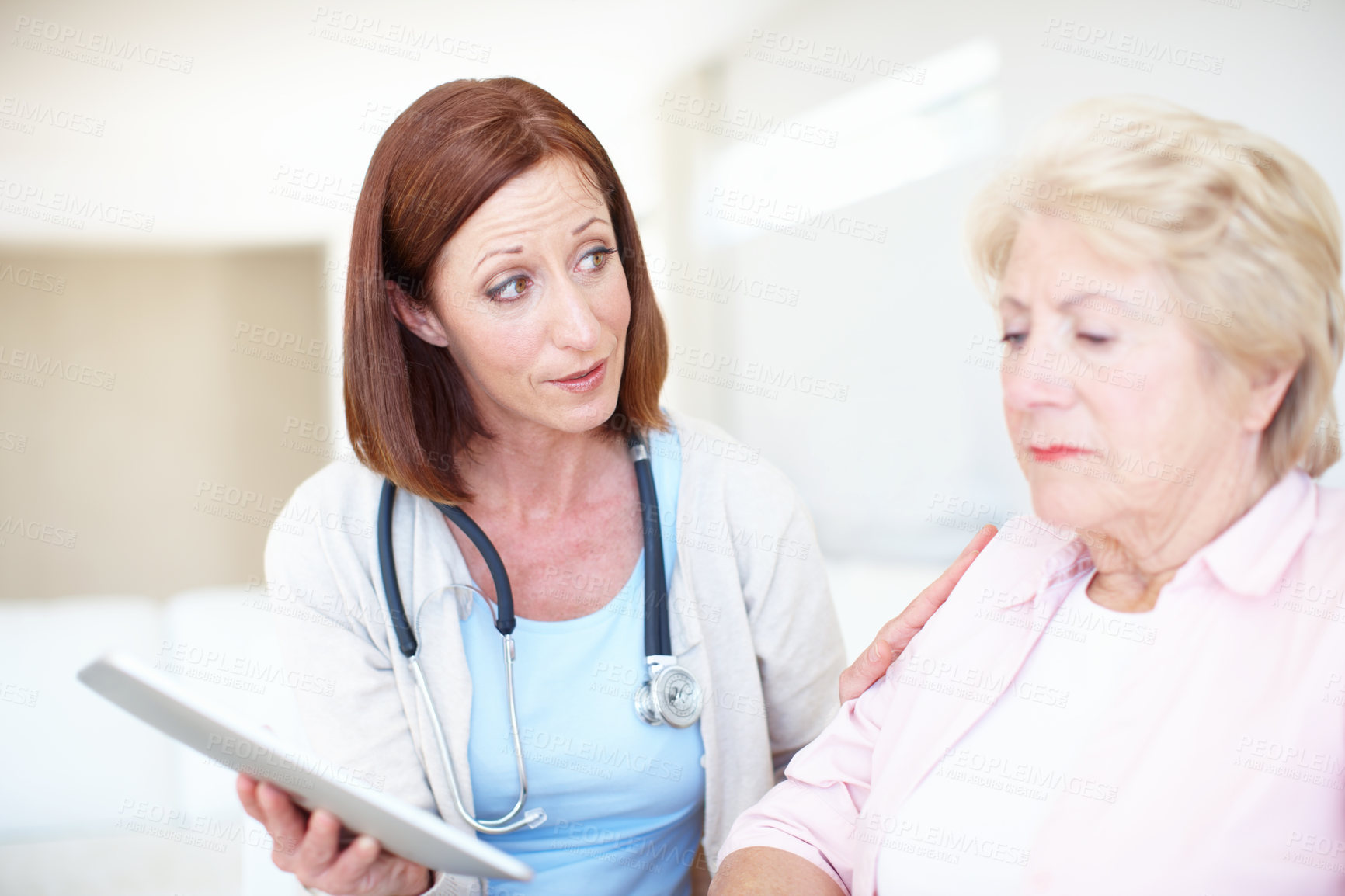 Buy stock photo Woman, senior patient and doctor with tablet for consultation or bad news at clinic. Female people, healthcare worker or employee talking to senior person with technology for elderly care or results