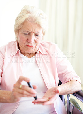 Buy stock photo Woman, wheelchair and senior patient with diabetes for injection, sick or pen on finger in elderly care. Mature person with disability,  pensioner or medical tool with diabetic needle prick and home 