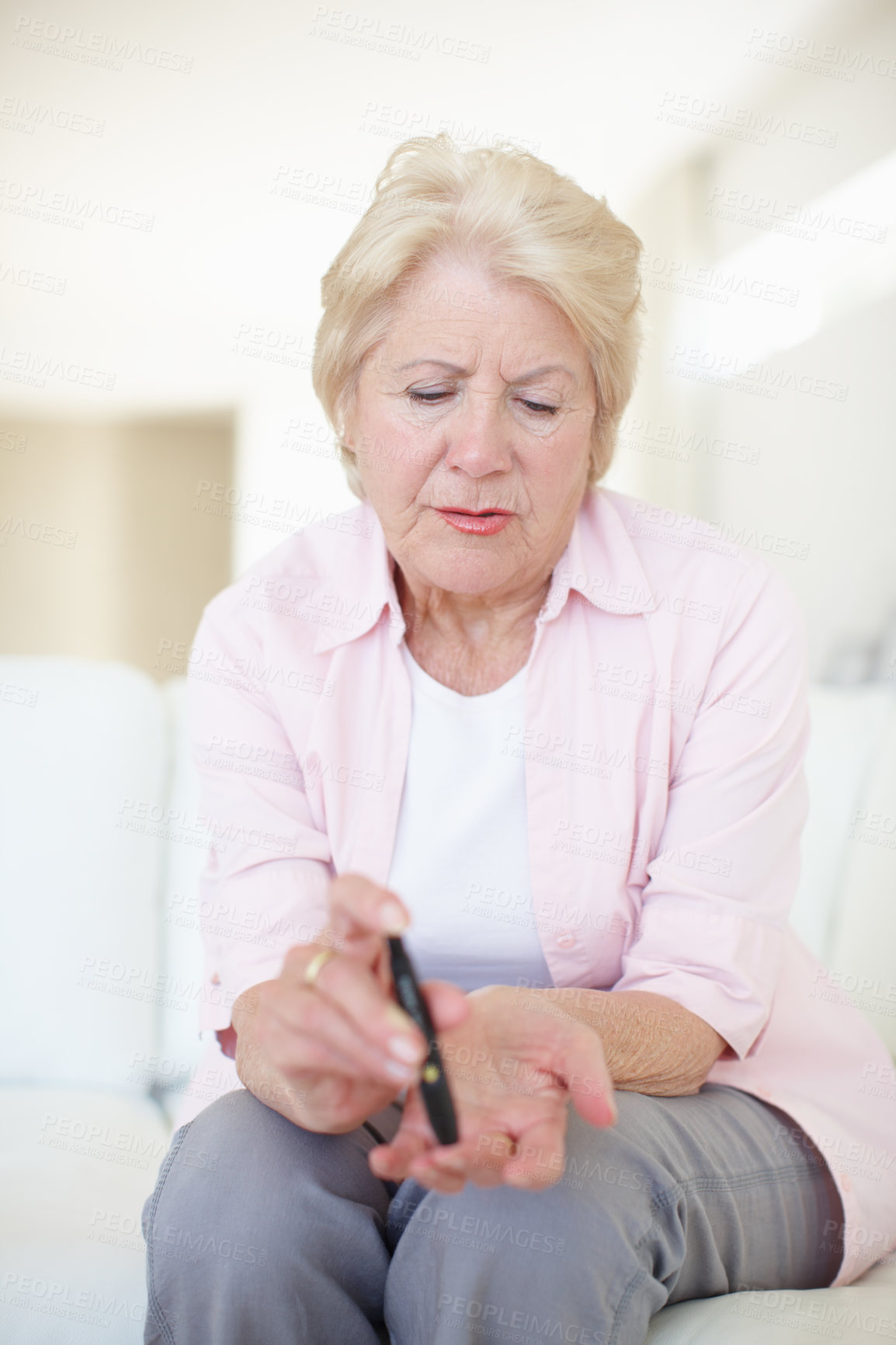 Buy stock photo House, illness and senior woman with diabetes for injection, sick or pen on finger in elderly care. Mature person,  pensioner or medical tool with diabetic needle prick and check blood sugar