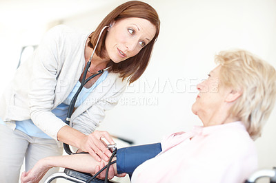 Buy stock photo Blood pressure, doctor and senior woman for medical service, exam and consulting with stethoscope. Healthcare, retirement and elderly person with disability for diabetes, heart rate and hypertension