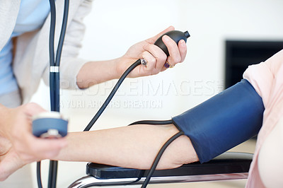 Buy stock photo Blood pressure, arm and doctor with senior patient for medical service, exam or consulting. Healthcare, wheelchair and hands of elderly person with disability for diabetes, heart rate or hypertension