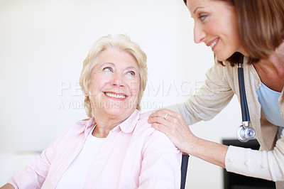 Buy stock photo Elderly female patient and her mature nurse have a conversation