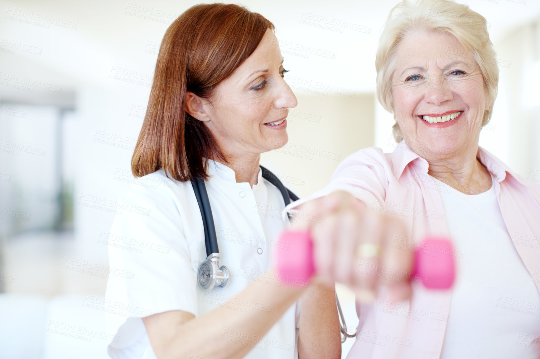 Buy stock photo Healthcare, dumbbell and physiotherapy with old woman and nurse for rehabilitation, muscle and consulting. Medical, osteoporosis and exam with senior person and weights for fitness, support or clinic