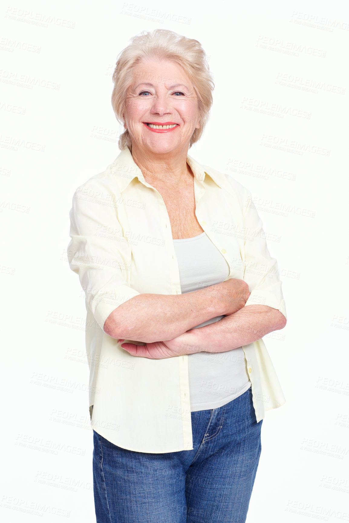 Buy stock photo Portrait of senior woman standing alone with her arms folded while isolated against white background in studio with copyspace. Smiling and happy elderly model with her arms crossed. Feeling assertive