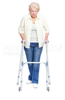 Buy stock photo Senior, woman and moving with walker for healthcare, retirement or old age home on a white studio background. Elderly, model or person with a disability or walking aid for medical assistance or help