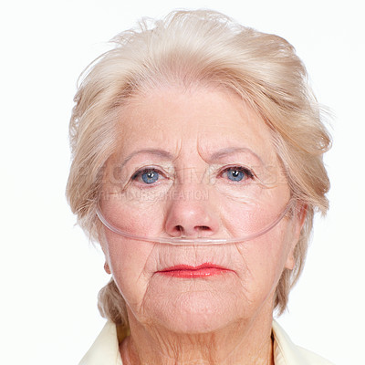 Buy stock photo Closeup portrait of a sickly senior woman wearing a nasal cannula for oxygen - Isolated on White