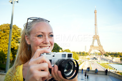 Buy stock photo A beautiful young woman taking photos while sight seeing in the Paris