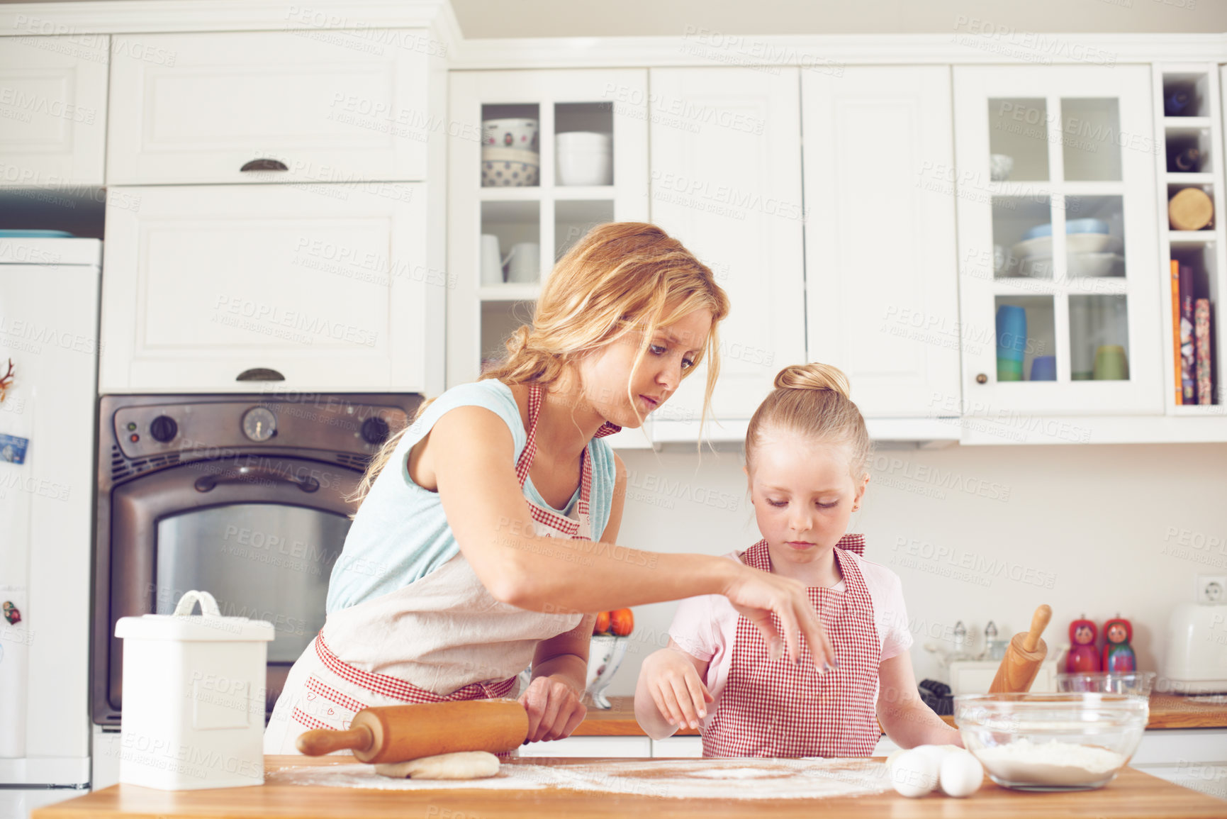 Buy stock photo Mother, girl and flour for baking in kitchen, dough preparation and teaching child skill in home. Mama, daughter and love for helping with cookies, cooking wheat and kid learning with rolling pin