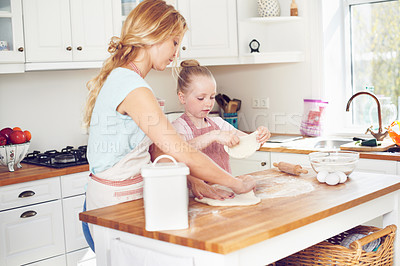 Buy stock photo Mother, girl and dough for dessert in kitchen, preparation and teaching child skill in home. Mama, daughter and love for helping with cookies, cooking wheat and kid learning to bake cake or pastry