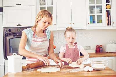 Buy stock photo Mother, girl and dough preparation in kitchen, baking together and teach child skill in home. Mama, daughter and love for helping with cookies, cooking wheat and kid learning to bake cake or pastry