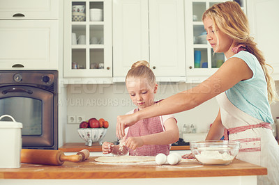 Buy stock photo Home, kid and mom with help baking for teaching, learning and happy bonding together for lunch. Love, mother and daughter with rolling pin, ingredients and cookie recipe in kitchen with child baker