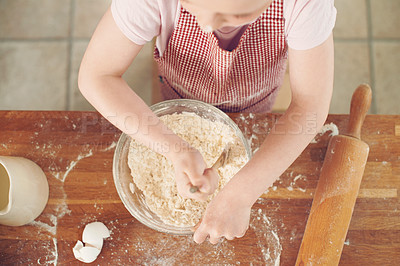 Buy stock photo Baking, mix and above of child in kitchen with dough for learning to bake cake, dessert and pastry. Bowl, culinary skills and young girl with ingredients, recipe and food for sweet treats in home