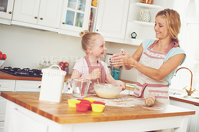 Buy stock photo Smile, child and mom in kitchen baking with teaching, learning and morning bonding together for lunch. Love, mother and daughter with help, ingredients and recipe for breakfast cupcake with kid baker