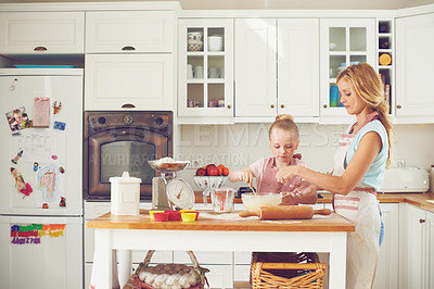 Buy stock photo Cupcake, child and mom in kitchen baking with teaching, learning and morning bonding together. Love, mother and daughter with help, ingredients and recipe for breakfast with girl kid baker in home