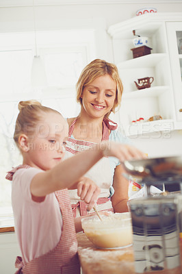 Buy stock photo Home, girl and mother with help baking for teaching, learning and morning bonding together. Love, mom and daughter with child development, ingredients and cake mix recipe in kitchen with kid baker