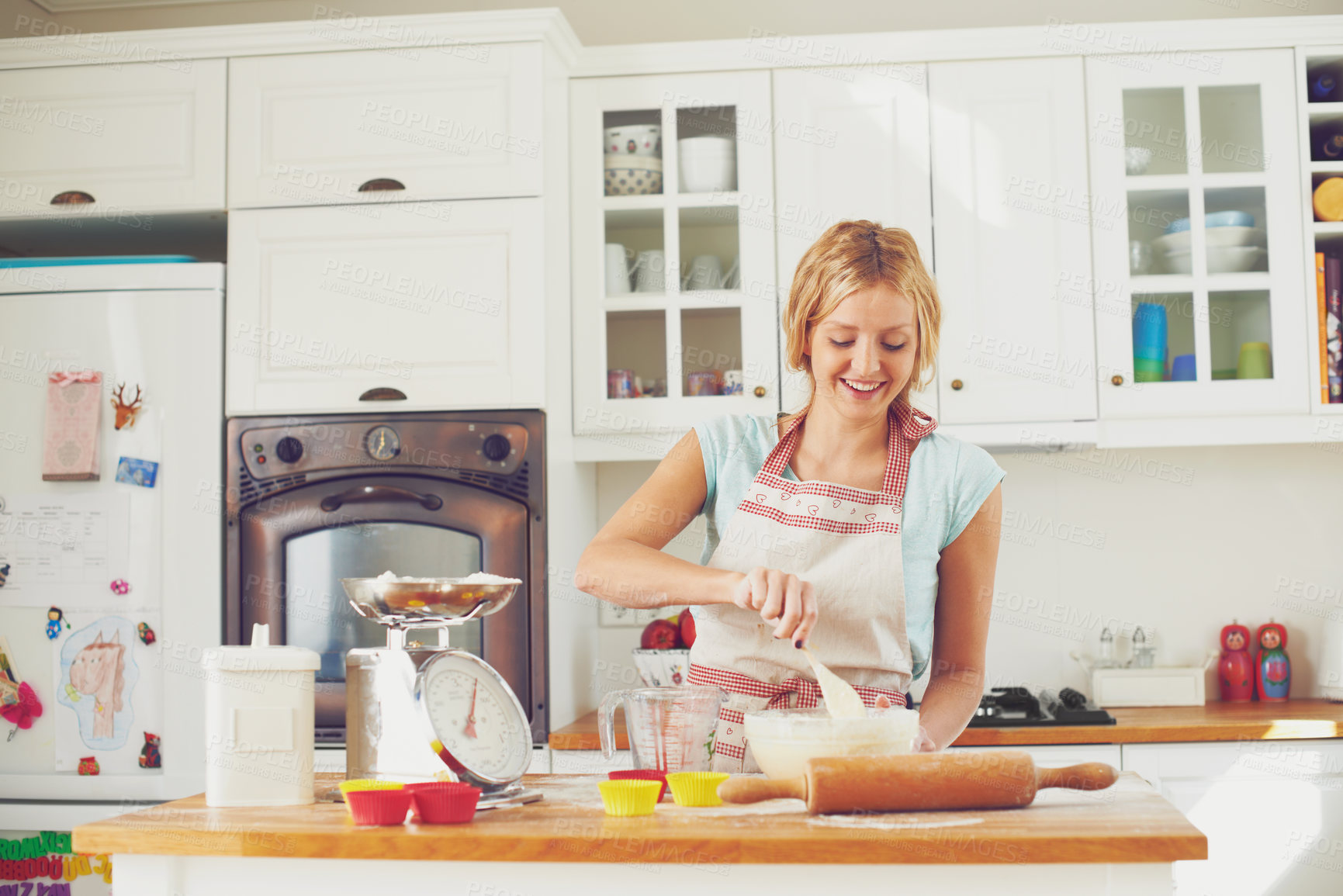 Buy stock photo Woman, happy and spoon in kitchen for baking, cookies and dessert with joy, bowl and ingredients. Female person, smile and recipe in home for cooking, cupcakes and pastry with flour, wheat or skills