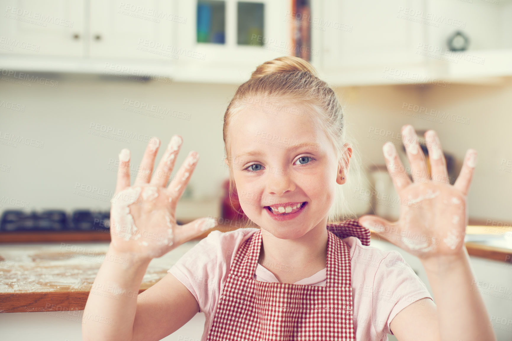 Buy stock photo Child, portrait and flour on hands in kitchen with baking fun, learning recipe and development with smile. Girl, kid and happy with culinary education, cake preparation and wheat ingredient in home