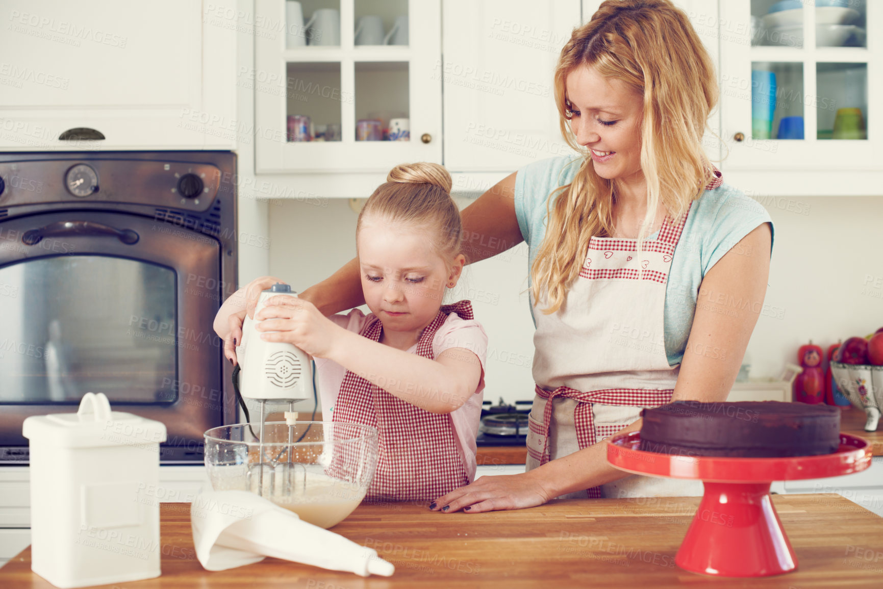 Buy stock photo Baking, cake and food with mother and child in kitchen for helping, ingredients and dessert recipe. Cookie, teaching and baker with girl and woman in family home for support, cooking and learning