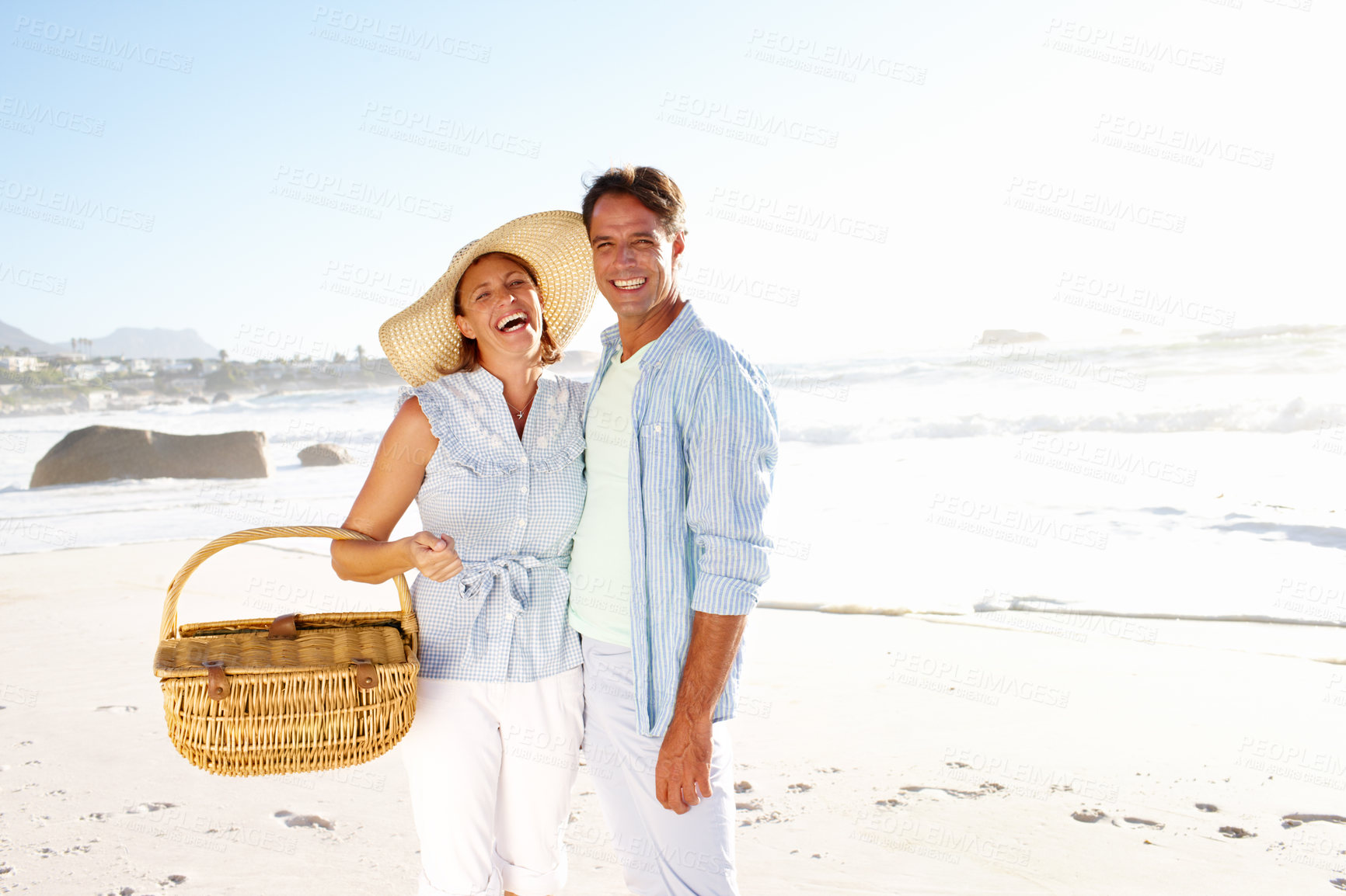 Buy stock photo Portrait, beach picnic and couple with love, nature and summer vacation in Miami. Man, woman and happy smile with ocean, holiday and bonding for relationship anniversary or weekend date by sea