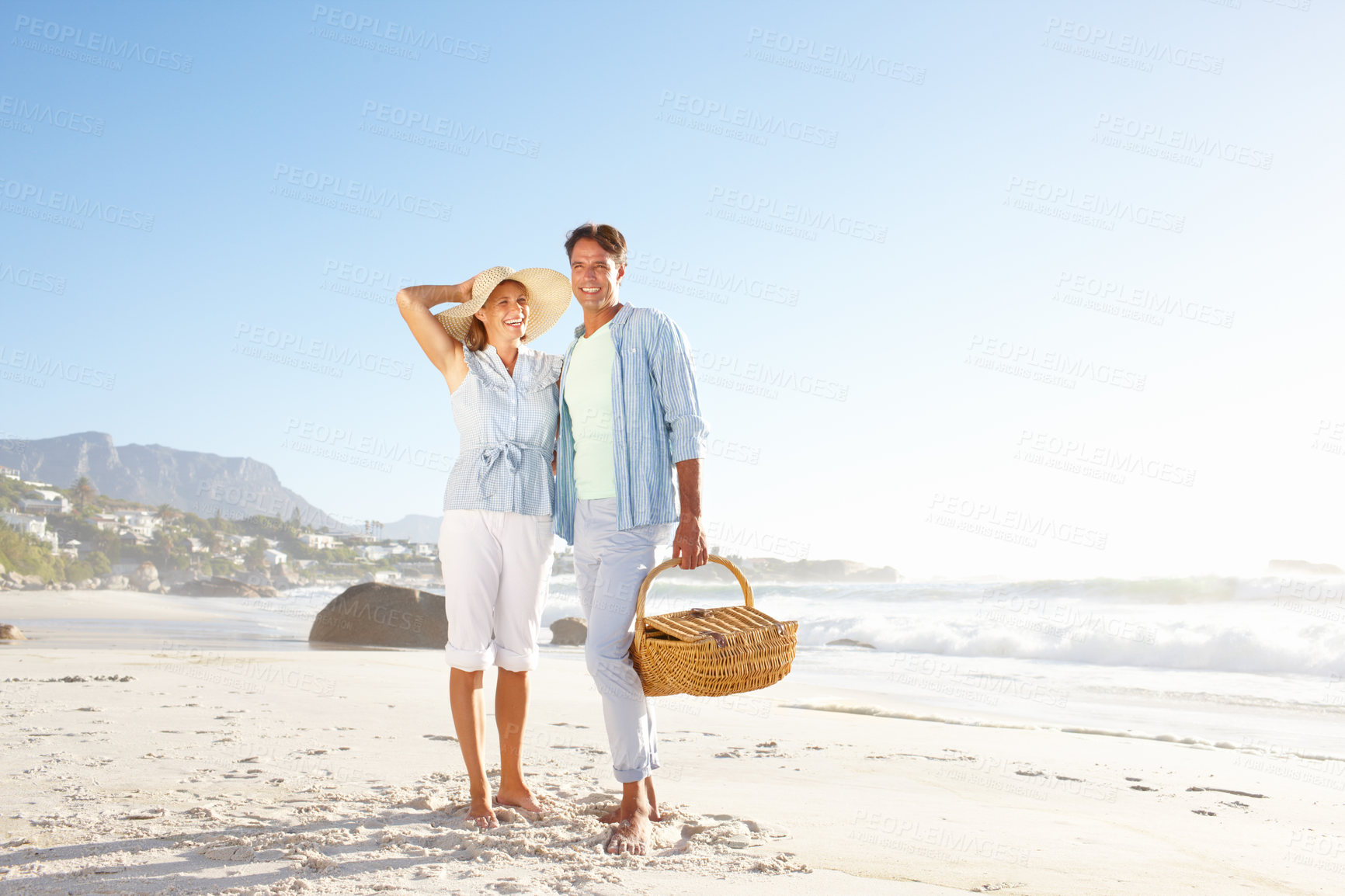 Buy stock photo Portrait, sea and mature couple with picnic, basket and love for summer vacation in Miami. Man, woman and smile with beach, holiday and bonding for relationship anniversary or weekend date by ocean