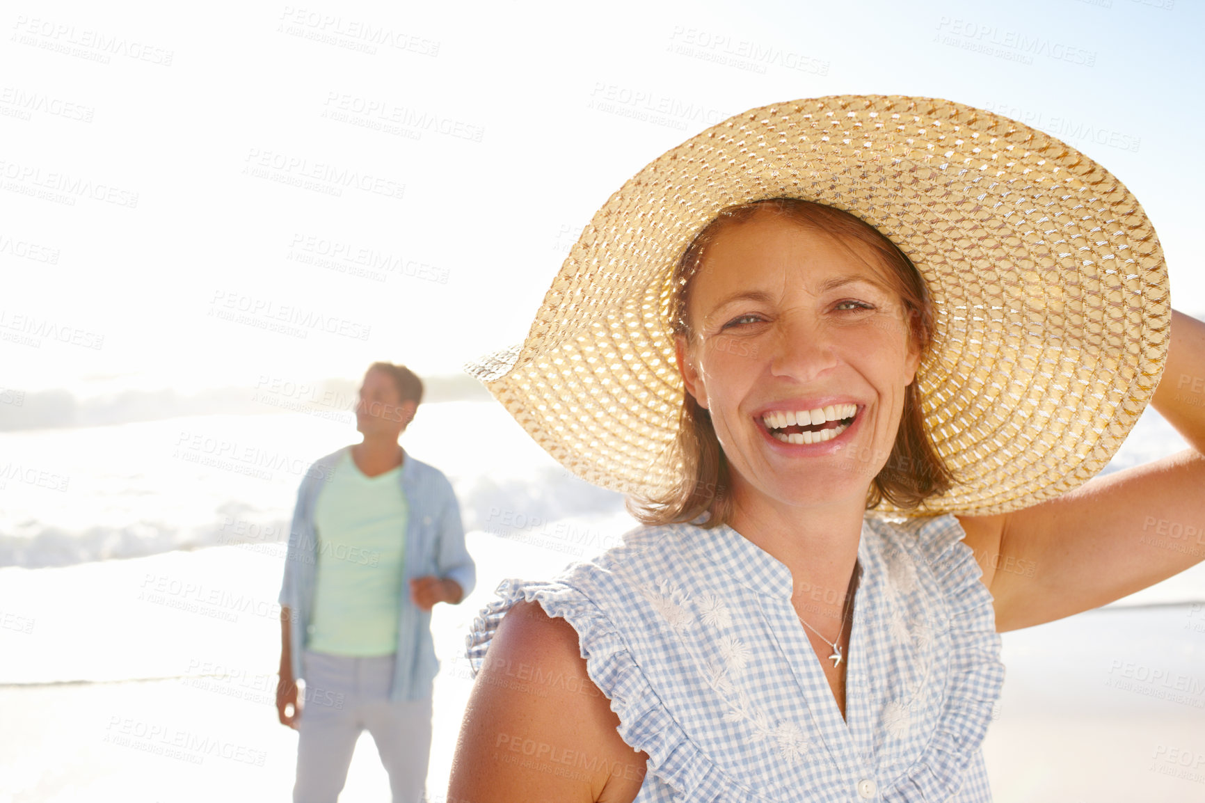 Buy stock photo Hat, happy woman or couple at sea to relax for love on vacation, anniversary or honeymoon holiday. Portrait, laughing or people with smile at beach paradise together for travel, bonding or ocean trip