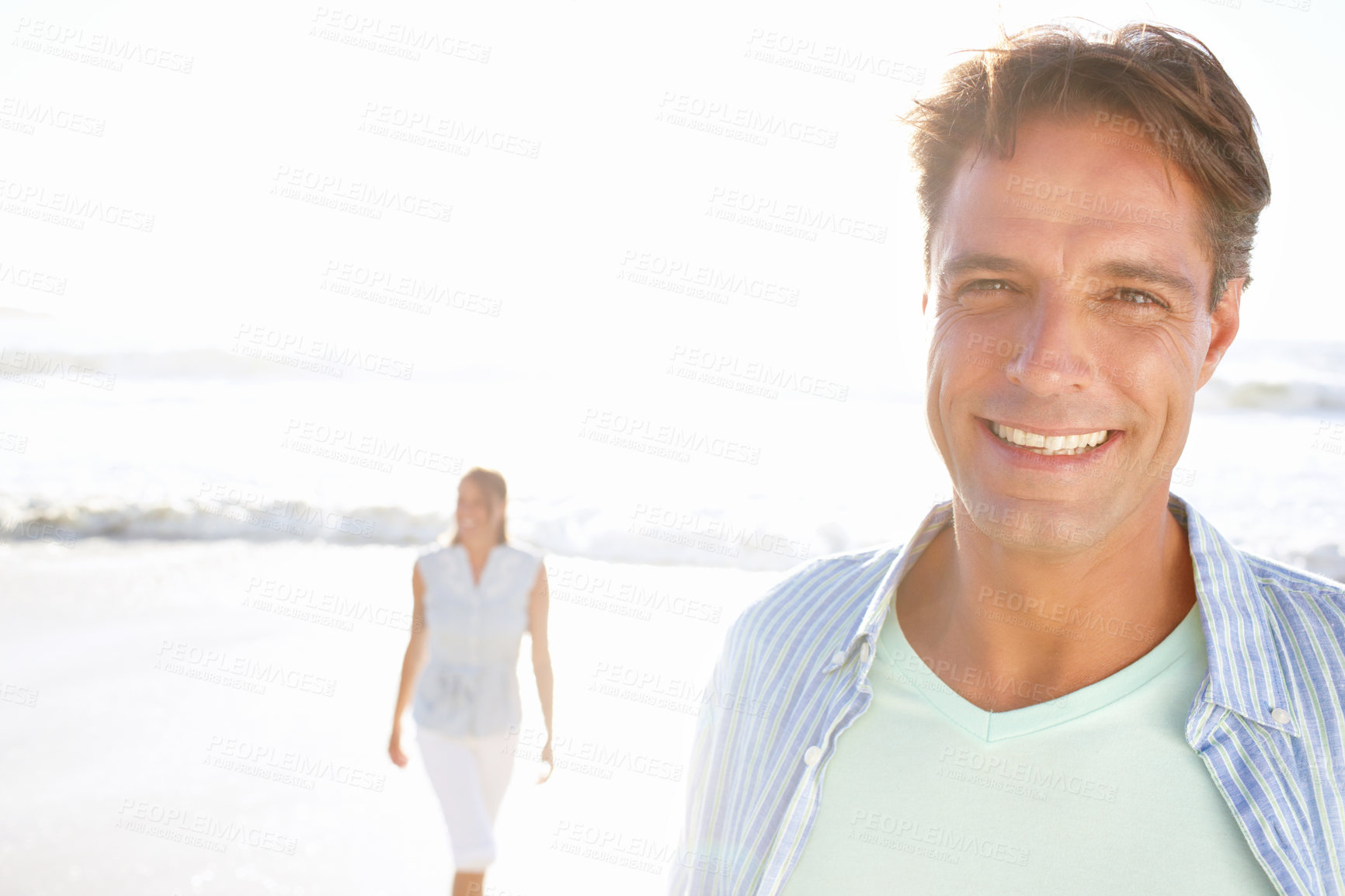 Buy stock photo Space, happy man or couple at sea for portrait or love on vacation, anniversary or honeymoon holiday. Mockup, face or people with smile at beach to relax together for travel, bonding or ocean trip