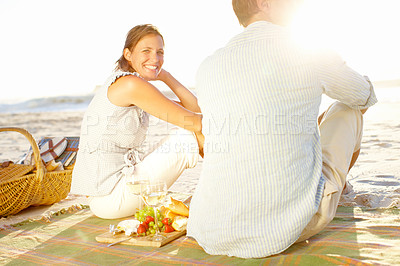 Buy stock photo Portrait of a happy woman enjoying a sunset on the beach with her husband