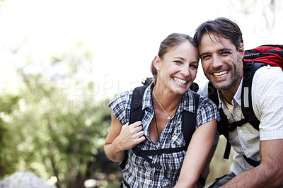 Buy stock photo Two hikers sitting outside and smiling at the camera - copyspace