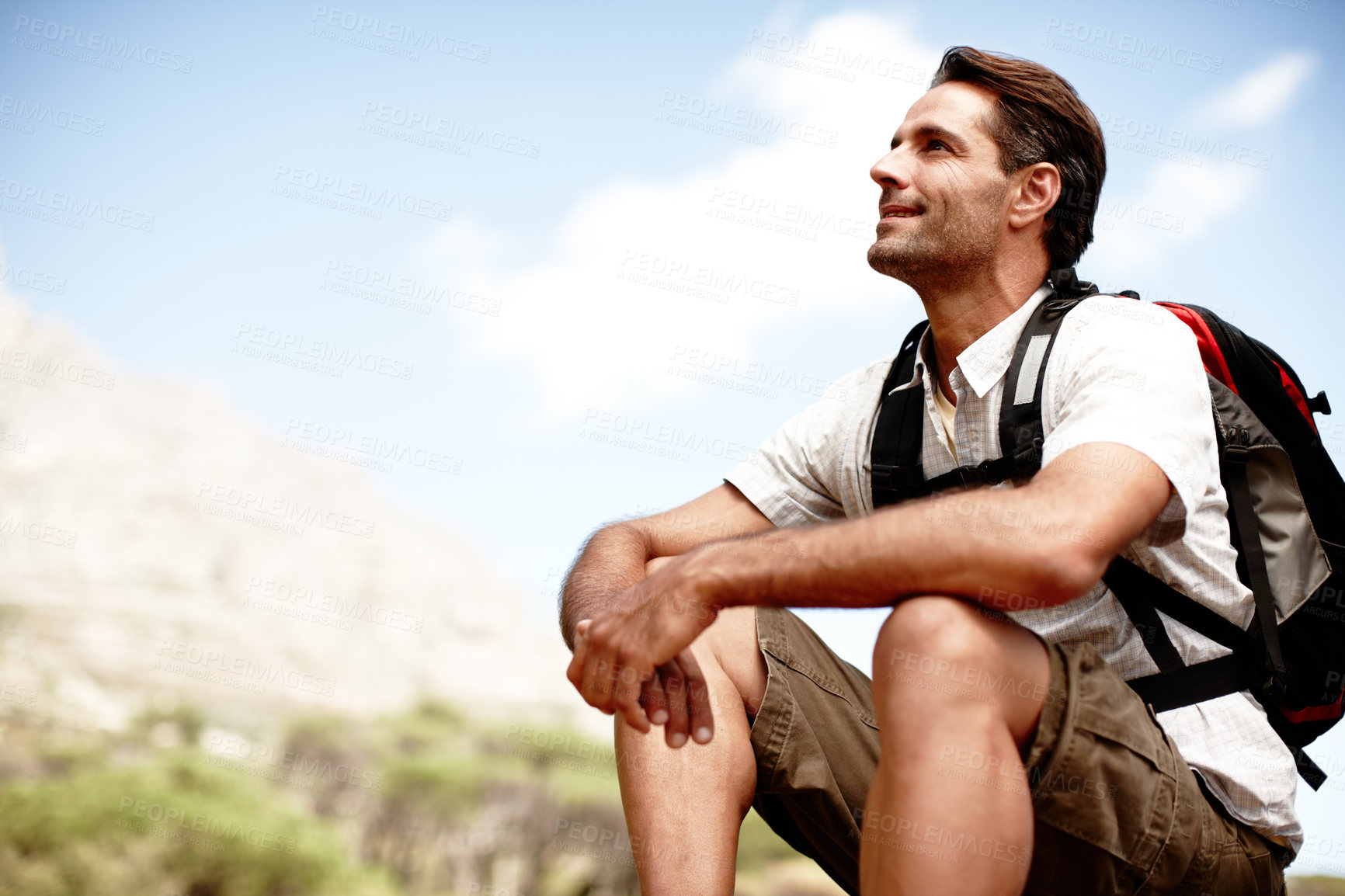 Buy stock photo Man, outdoor hiking and thinking on mountain, holiday adventure and contemplating future on trip. Male person, profile and relax on vacation to dream of journey, location and trekking break on cliff