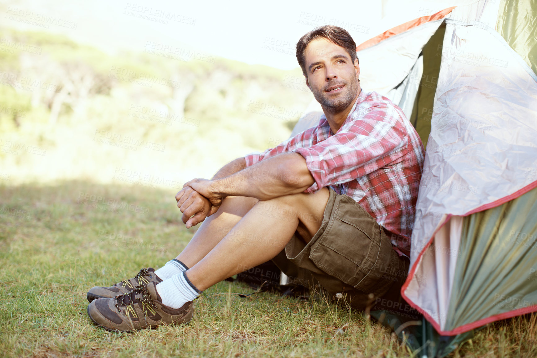 Buy stock photo Outdoor, man and ideas by tent for camping, holiday and travel vacation with confidence in wilderness. Nature, male person and traveler with thinking for hiking, adventure and campsite in countryside