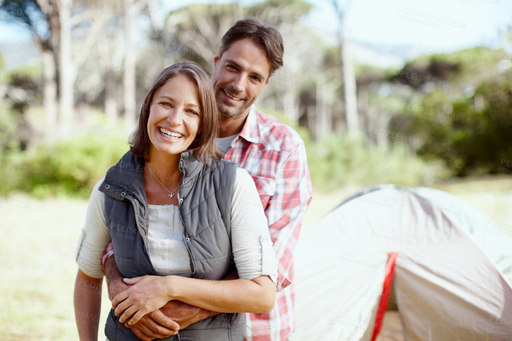 Buy stock photo Couple, portrait and outdoor camping with hug, love and bonding adventure in Costa Rica. Happy people, sustainable honeymoon and together on holiday, embrace romance and weekend trip for connection