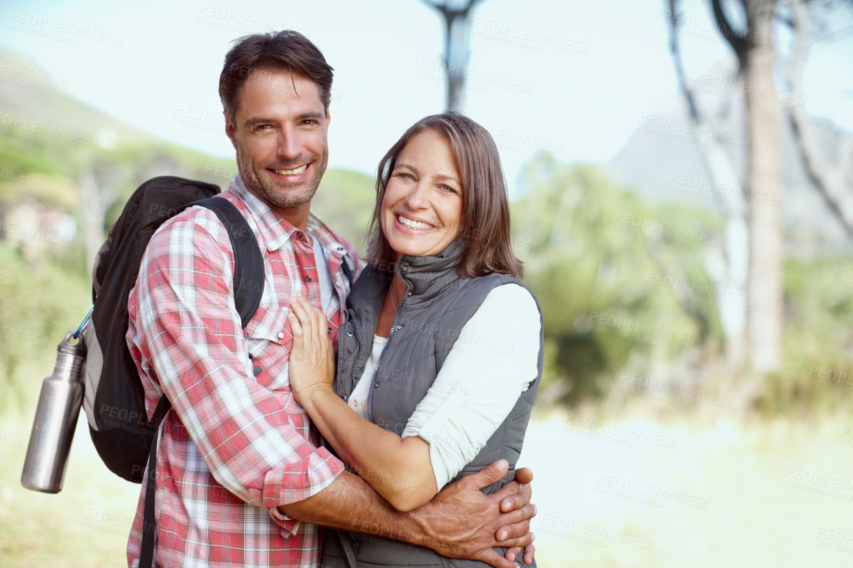 Buy stock photo Hug, portrait or happy couple in nature for hiking, adventure or travel journey on break in woods. Love, smile or people in forest to relax together for holiday vacation or trekking to explore park