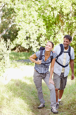 Buy stock photo Couple, walking and tired in nature for hiking, fitness and adventure with bonding, love and injury. Man, woman and  fatigue outdoor for exercise, health and trekking with journey, travel or accident