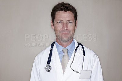 Buy stock photo Portrait, man and doctor with stethoscope in studio background for healthcare, cardiologist and support. Mature person, employee and medical professional with confidence or pride for surgery and help