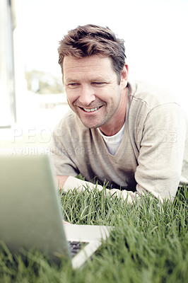 Buy stock photo Man, outdoor and laptop for remote work, worker and backyard lawn for copywriting website article. Male person, nature and freelance writer to update column, communication and internet for news