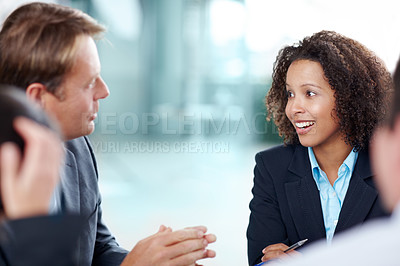 Buy stock photo Mature businessman having a discussion with a younger colleague 