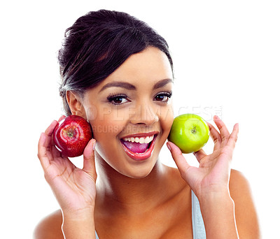 Buy stock photo A young woman in gymwear holding two apples and smiling at the camera