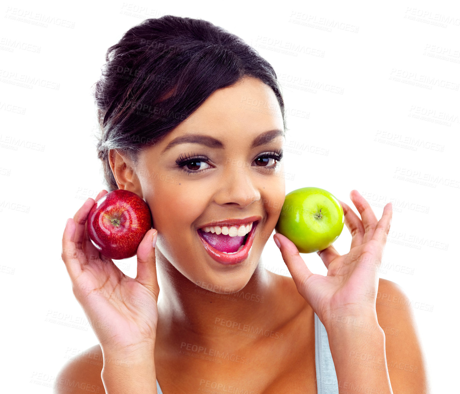 Buy stock photo A young woman in gymwear holding two apples and smiling at the camera