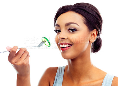 Buy stock photo A young woman eating a slice of cucumber