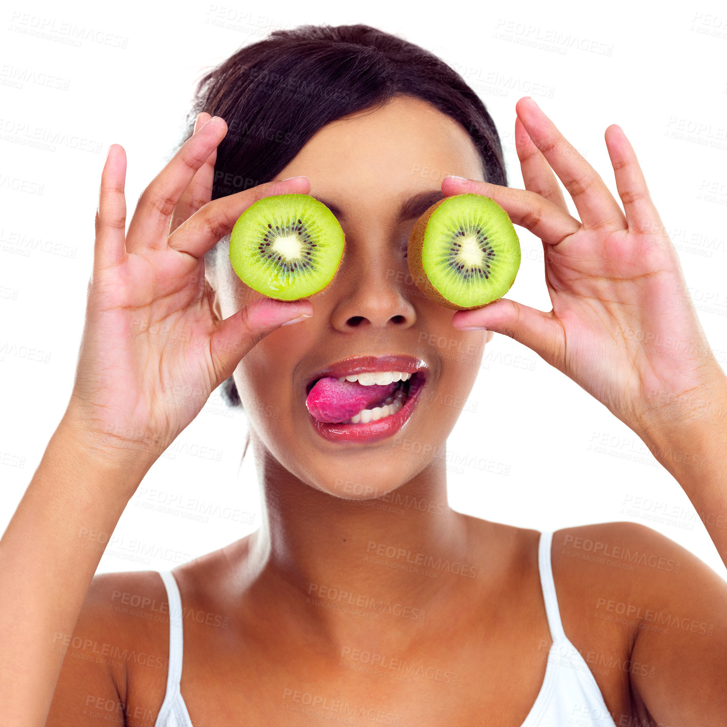 Buy stock photo Cropped shot of a beautiful young woman holding kiwis in front of her eyes
