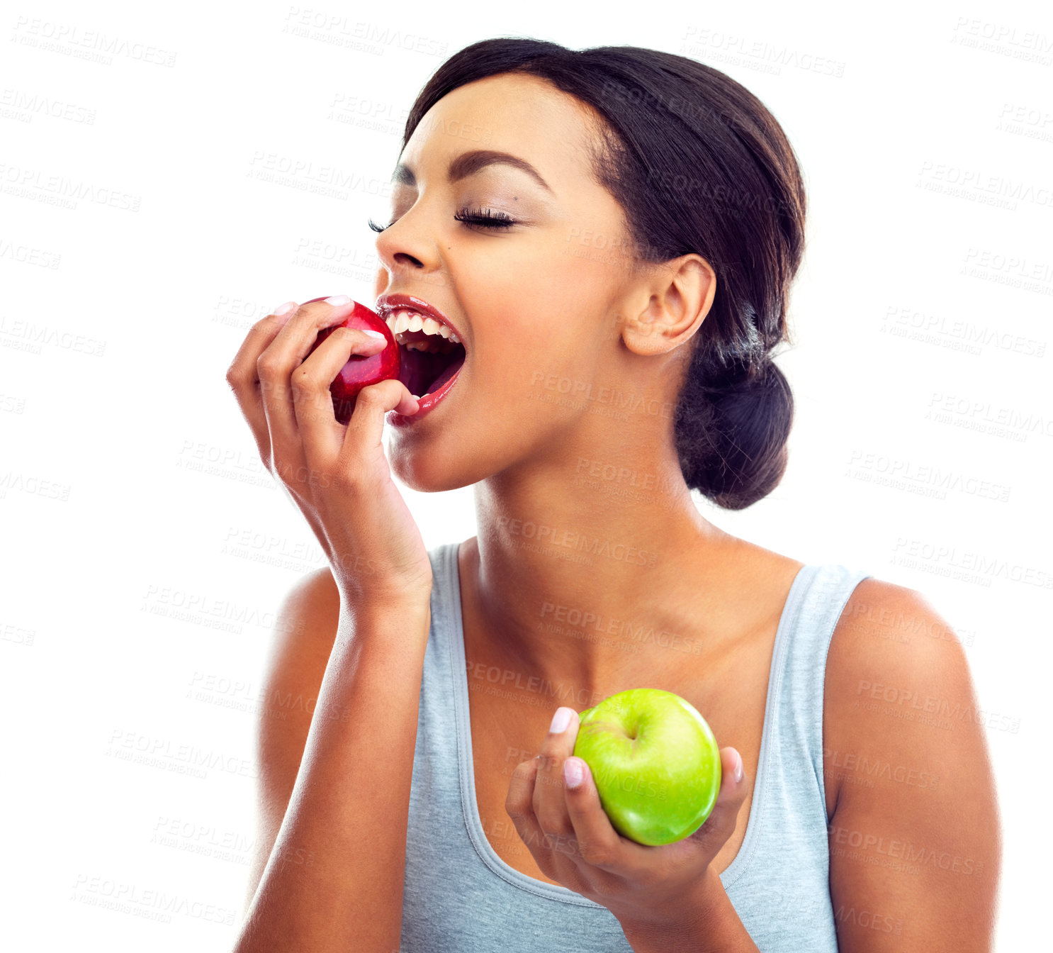 Buy stock photo Face, bite and woman with apple, nutrition and sustainable eating to lose weight in studio. Fruit, happy and girl with fresh food for detox diet, vitamins and gut health on white background.