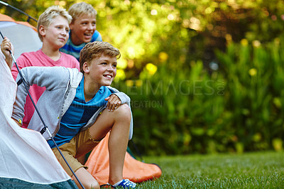 Buy stock photo Cropped shot of three young boys looking out of their tent