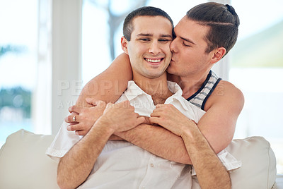 Buy stock photo Shot of a gay couple relaxing together at home