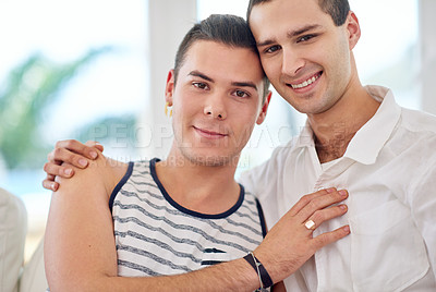 Buy stock photo Shot of a gay couple relaxing together at home