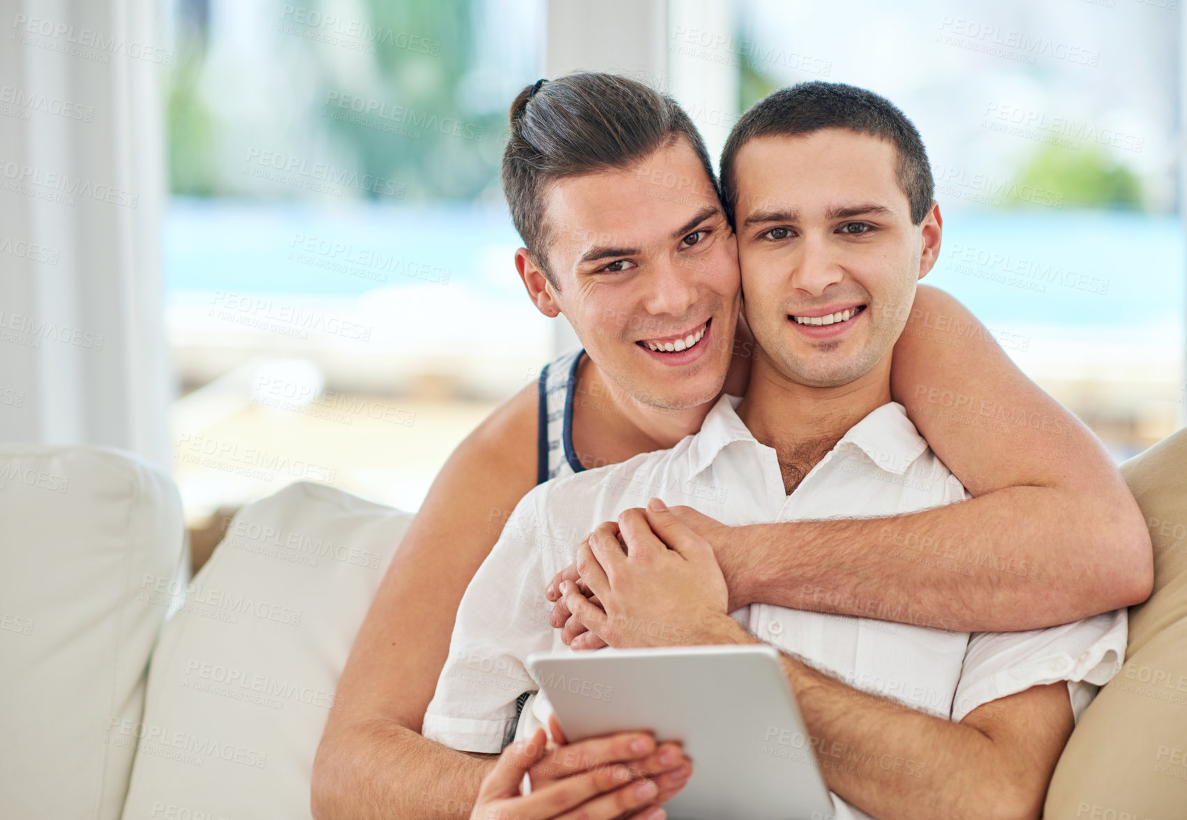 Buy stock photo Gay couple, portrait and tablet in home for social media, streaming and online shopping on sofa. Men, partners and technology in living room for browsing, connectivity or latest LGBT news on internet